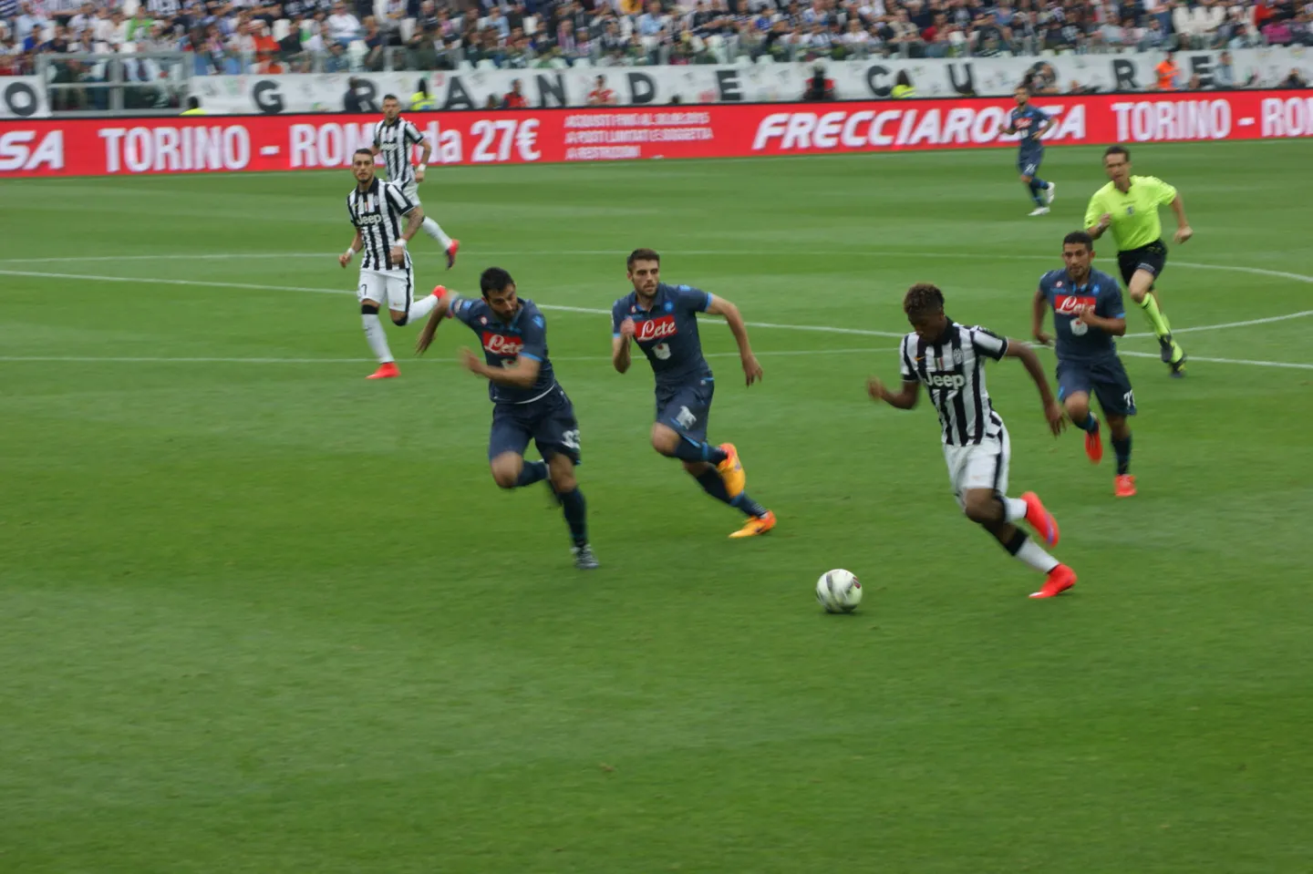 Players from Juventus and Napoli compete during a Serie A football match in Turin.
